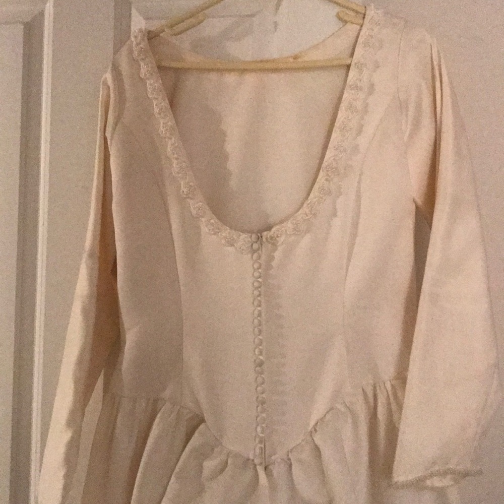 Off white high neckline low back wedding dress.